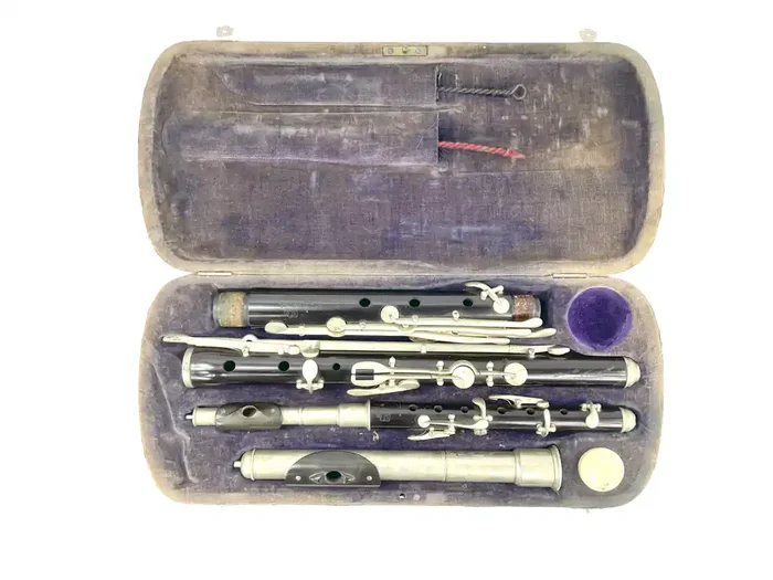 Melodia German Flute and Piccolo set and case, metal head joint, year unknown.